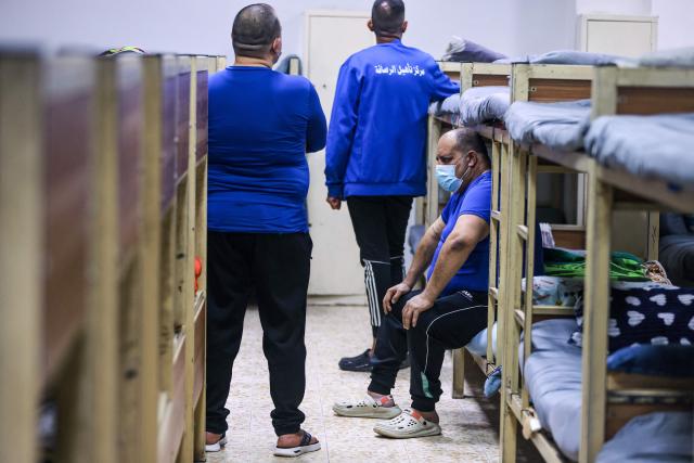 Patients are seen in their dormitories the Al-Rusafa Center for Drug Rehabilitation and Treatment in Baghdad on April 20, 2026. Iraq, which borders Syria, Iran, Saudi Arabia, and Kuwait, is a transit country for drug smuggling and has become a major corridor for the drug trade in recent years, particularly for Captagon and crystal meth. Baghdad regularly announces the seizure of large quantities of narcotics, most notably Captagon, for which Saudi Arabia is the primary destination. (Photo by AHMAD AL-RUBAYE / AFP)