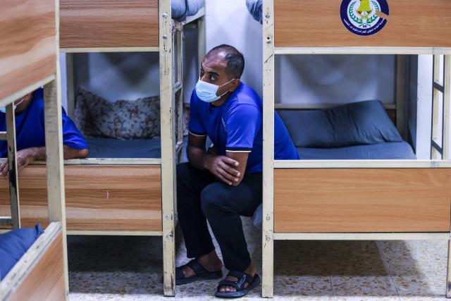 Patients sit in their dormitories the Al-Rusafa Center for Drug Rehabilitation and Treatment in Baghdad on April 20, 2026. Iraq, which borders Syria, Iran, Saudi Arabia, and Kuwait, is a transit country for drug smuggling and has become a major corridor for the drug trade in recent years, particularly for Captagon and crystal meth. Baghdad regularly announces the seizure of large quantities of narcotics, most notably Captagon, for which Saudi Arabia is the primary destination. (Photo by AHMAD AL-RUBAYE / AFP)