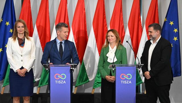 Election winner and leader of Hungary's TISZA party Peter Magyar (2nd L), Agnes Forsthoffer (L), vice-president of the TISZA party and designated speaker of Hungary's parliament, Andrea Bujdoso (2nd R), TISZA's designated parliamentary group leader, and TISZA's campaign director Zoltan Toth address a press conference following the first official meeting of TISZA's new parliamentary group at the HUNGEXPO Congress and Exhibition Center in Budapest, Hungary, on April 20, 2026. Hungary's nationalist long-time Prime Minister Viktor Orban lost on April 12, 2026 to political newcomer, conservative pro-EU Peter Magyar, whose party won a two-thirds parliamentary majority in a vote marked by record turnout in the central European country. (Photo by Attila KISBENEDEK / AFP)
