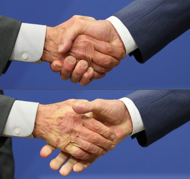 (COMBO) This combination of pictures created on April 20, 2026 shows a handshake of Brazilian President Luiz Inacio Lula da Silva (L) and German Chancellor Friedrich Merz at the end of their joint press conference following the German-Brazilian governmental consultations meeting in Hanover, northern Germany on April 20, 2026, that is taking place on the sidelines of the Hannover Messe industrial trade fair. Brazil is the 2026 partner country of the fair, that will be running until April 24, 2026. (Photo by Odd ANDERSEN / AFP)