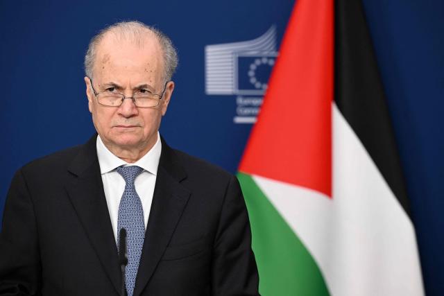 Palestinian Prime Minister Mohamed Mustafa listens during a joint press statement with Norwegian Minister for Foreign Affairs and EU High Representative and Vice-President for Foreign Affairs and Security Policy before a Ad Hoc Liaison Committee (AHLC) Ministerial Meeting, in Brussels on April 20, 2026. European backers put on a show of support for the Palestinian Authority and the push for a two-state solution, as the US-Israeli war with Iran has dragged focus away from Gaza. (Photo by Nicolas TUCAT / AFP)
