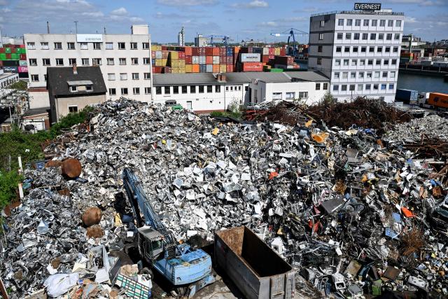 Containers of Danish shipping company Maersk and other ones are stacked in front of utilisation area at a transshipment station in Ludwigshafen, western Germany, on April 20, 2026. (Photo by Kirill KUDRYAVTSEV / AFP)