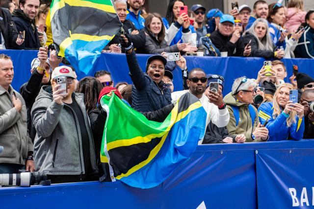 Fans cheer on runners in the men's division during the 130th Boston Marathon on April 20, 2026, in Boston, Massachusetts. (Photo by Joseph Prezioso / AFP)