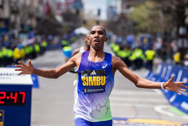 Tanzanian long-distance runner Alphonce Simbu crosses the finish line as he finishes in second place in the men's division during the 130th Boston Marathon on April 20, 2026, in Boston, Massachusetts. (Photo by Joseph Prezioso / AFP)
