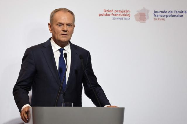 Polish Prime Minister Donald Tusk addresses guests during the ceremony for the presentation of the Bronislaw Geremek Award at the European Solidarity Centre in Gdansk, Poland, on April 20, 2026 during the French President's one-day visit to Poland. (Photo by Ludovic MARIN / AFP)
