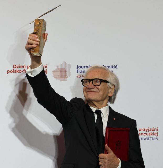 Laureate Polish actor and director Andrzej Seweryn reacts after having received the Bronislaw Geremek Award during a ceremony at the European Solidarity Centre in Gdansk, Poland, on April 20, 2026 during the French President's one-day visit to Poland. (Photo by Ludovic MARIN / AFP)