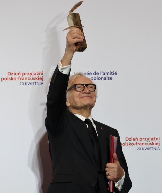 Laureate Polish actor and director Andrzej Seweryn reacts after having received the Bronislaw Geremek Award during a ceremony at the European Solidarity Centre in Gdansk, Poland, on April 20, 2026 during the French President's one-day visit to Poland. (Photo by Ludovic MARIN / AFP)