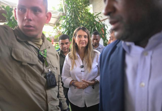 Colombia's right-wing presidential candidate Paloma Valencia, of the Centro Democratico party, arrives for a campaign rally surrounded by heavy security in Cali, Valle del Cauca department, Colombia on April 20, 2026. Colombia will hold a presidential election on May 31, 2026. (Photo by JOAQUIN SARMIENTO / AFP)