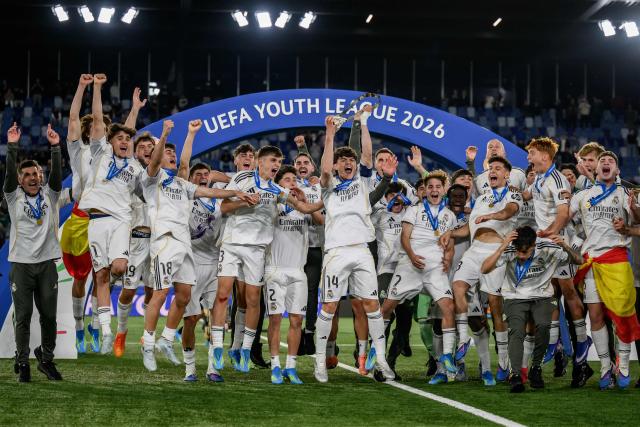 Real Madrid's players celebrate with the trophy after winning the UEFA Youth League final football match between Club Brugge and Real Madrid at Stade de la Tuiliere in Lausanne, on April 20, 2026. (Photo by Fabrice COFFRINI / AFP)