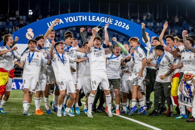 Real Madrid's players celebrate after winning the UEFA Youth League final football match between Club Brugge and Real Madrid at Stade de la Tuiliere in Lausanne, on April 20, 2026. (Photo by Fabrice COFFRINI / AFP)