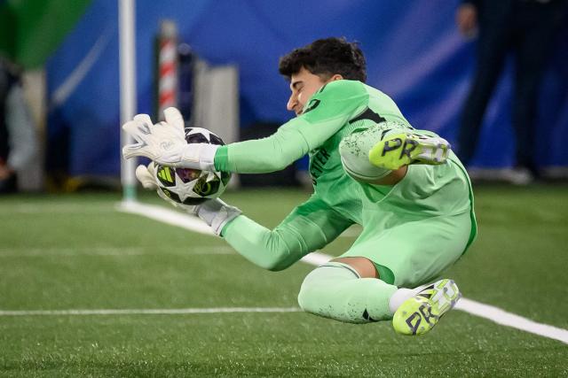 Real Madrid's Spanish goalkeeper #1 Javier Navarro block a ball during the penalty shoot-out during the UEFA Youth League final football match between Club Brugge and Real Madrid at Stade de la Tuiliere in Lausanne, on April 20, 2026. (Photo by Fabrice COFFRINI / AFP)