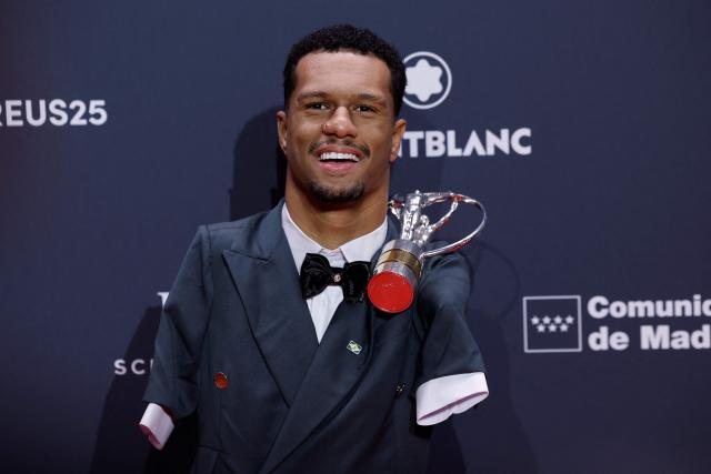 Brazil's paralympics swimmer Gabriel dos Santos poses with his Laureus World Sportsperson of the Year with a Disability Award during the 27th Laureus World Sports Awards gala in Madrid on April 20, 2026. (Photo by Oscar DEL POZO / AFP)