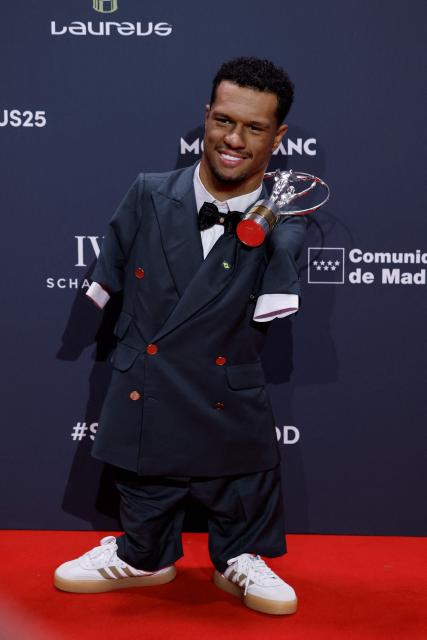 Brazil's paralympics swimmer Gabriel dos Santos poses with his Laureus World Sportsperson of the Year with a Disability Award during the 27th Laureus World Sports Awards gala in Madrid on April 20, 2026. (Photo by Oscar DEL POZO / AFP)