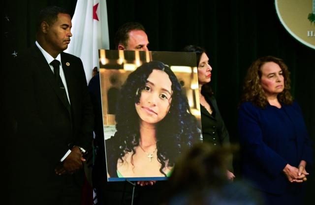 A portrait of the late Celeste Rivas Hernandez is shown during a press briefing by Los Angeles County District Attorney Nathan J. Hochman (out of frame) on the case against singer D4vd in Los Angeles, on April 20, 2026. Singer D4vd was charged April 20 with the murder and dismemberment of his young teenage girlfriend, whose decomposing corpse was found in a Tesla that had been abandoned in the Hollywood Hills. The 21-year-old, whose real name is David Anthony Burke, was expected to appear in court Monday to face multiple charges over the horrifying death of Celeste Rivas Hernandez, whose body was discovered in September, within days of what would have been her 15th birthday. (Photo by Frederic J. BROWN / AFP)