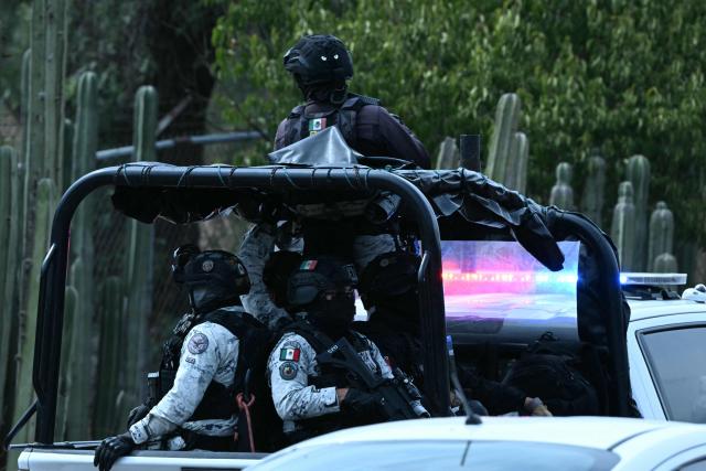 Members of Mexico's National Guard patrol the Teotihuacan archaeological zone in an official vehicle following a shooting in Teotihuacan, State of Mexico, on April 20, 2026. A Canadian woman was shot dead on April 20 at the Teotihuacan pyramids archaeological zone in central Mexico by a man who later killed himself, authorities said. (Photo by YURI CORTEZ / AFP)