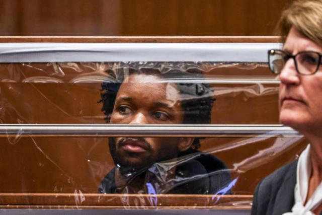 US singer D4vd is seen during his arraignment at Clara Shortridge Foltz Criminal Justice Center in Los Angeles, on April 20, 2026. Singer D4vd was charged Monday with the murder and dismemberment of a teenage girl whose decomposing body was found in an abandoned Tesla in the Hollywood Hills. The 21-year-old, whose real name is David Anthony Burke, appeared in court Monday to face multiple charges over the horrifying death of Celeste Rivas Hernandez, whose body was found in September, within days of what would have been her 15th birthday. (Photo by Ted Soqui / POOL / AFP)