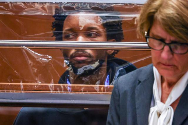 US singer D4vd is seen during his arraignment at Clara Shortridge Foltz Criminal Justice Center in Los Angeles, on April 20, 2026. Singer D4vd was charged Monday with the murder and dismemberment of a teenage girl whose decomposing body was found in an abandoned Tesla in the Hollywood Hills. The 21-year-old, whose real name is David Anthony Burke, appeared in court Monday to face multiple charges over the horrifying death of Celeste Rivas Hernandez, whose body was found in September, within days of what would have been her 15th birthday. (Photo by Ted Soqui / POOL / AFP)