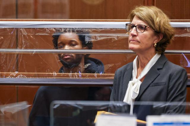 US singer D4vd is seen during his arraignment at Clara Shortridge Foltz Criminal Justice Center in Los Angeles, on April 20, 2026. Singer D4vd was charged Monday with the murder and dismemberment of a teenage girl whose decomposing body was found in an abandoned Tesla in the Hollywood Hills. The 21-year-old, whose real name is David Anthony Burke, appeared in court Monday to face multiple charges over the horrifying death of Celeste Rivas Hernandez, whose body was found in September, within days of what would have been her 15th birthday. (Photo by TED SOQUI / POOL / AFP)