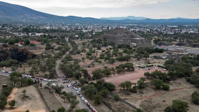 An aerial view shows the Pyramid of the Moon at the Teotihuacan archaeological zone following a shooting in Teotihuacan, State of Mexico, on April 20, 2026. A Canadian woman was shot dead on April 20 at the Teotihuacan pyramids archaeological zone in central Mexico by a man who later killed himself, authorities said. (Photo by Yuri CORTEZ / AFP)
