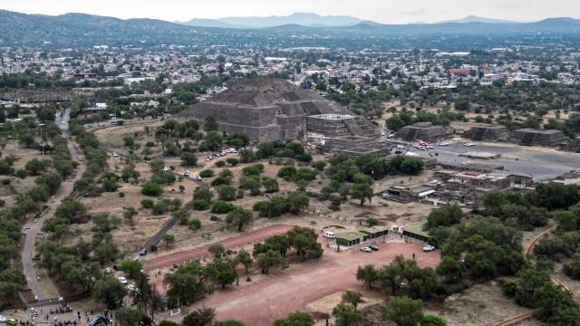 An aerial view shows the Pyramid of the Moon at the Teotihuacan archaeological zone following a shooting in Teotihuacan, State of Mexico, on April 20, 2026. A Canadian woman was shot dead on April 20 at the Teotihuacan pyramids archaeological zone in central Mexico by a man who later killed himself, authorities said. (Photo by Yuri CORTEZ / AFP)