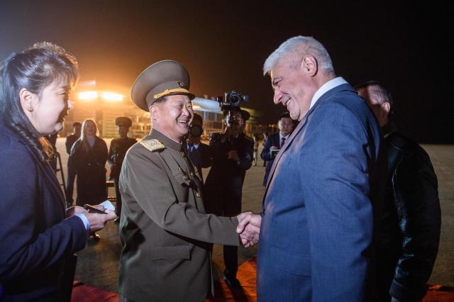 Russia’s Minister of Internal Affairs Vladimir Kolokoltsev (R) is greeted by North Korea’s Minister of Public Security Pang Tu-sop after his arrival at Pyongyang International Airport on April 20, 2026. (Photo by KIM Won Jin / AFP)