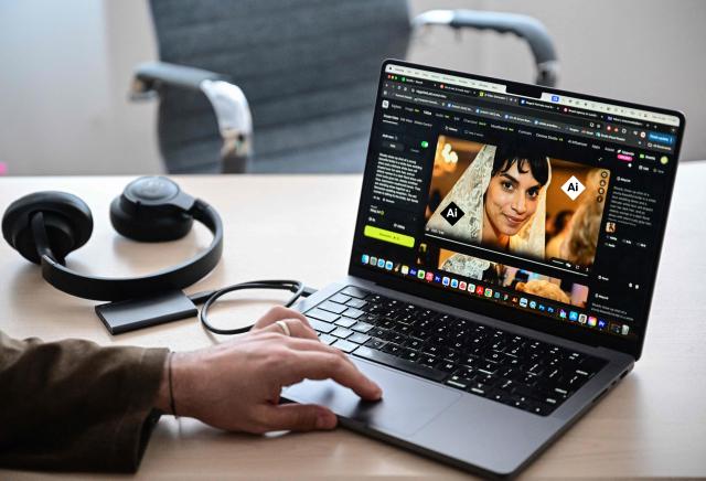 Tom, the creator of AI generated singer Lolita, works on a new music video of his character in Bucharest, Romania, on March 9, 2026. Lolita's popularity has stirred questions in Romania about artificial intelligence replacing humans, as well as stereotypes in a country with a history of discriminating against the Roma. Lolita creator Tom, who has described his project as "a fusion of Balkan nostalgia and the synthetic future", insists Lolita "doesn't necessarily belong to a specific culture". (Photo by Daniel MIHAILESCU / AFP)