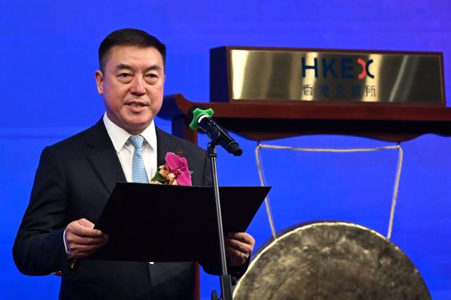 Chairman of Victory Giant Technology Chen Tao speaks at the launch of his company's IPO at the Hong Kong Exchanges and Clearing Limited (HKEX) In Hong Kong on April 21, 2026. (Photo by Peter PARKS / AFP)
