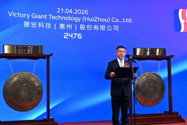 Chairman of Victory Giant Technology Chen Tao speaks at the launch of his company's IPO at the Hong Kong Exchanges and Clearing Limited (HKEX) In Hong Kong on April 21, 2026. (Photo by Peter PARKS / AFP)