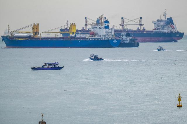 This picture shows vessels anchored along the Singapore straits eastern anchorage in Singapore on April 21, 2026. (Photo by Roslan RAHMAN / AFP)
