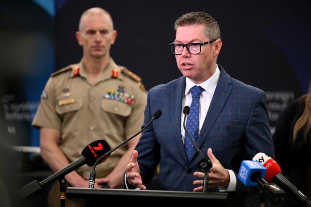 Australia's Minister for Defence Industry Pat Conroy (R) speaks during a press conference as the Australian Government announces it will invest 5 billion USD over the next decade in counter drones for the Australian Defence Force (ADF), in Melbourne on April 21, 2026 (Photo by William WEST / AFP)