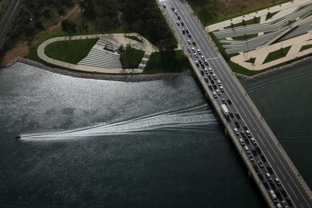 A view of vehicles driving along a bridge spanning the Bouregreg River, seen from the observation deck of the Mohammed VI Tower in Salé on April 20, 2026. (Photo by Abdel Majid BZIOUAT / AFP)