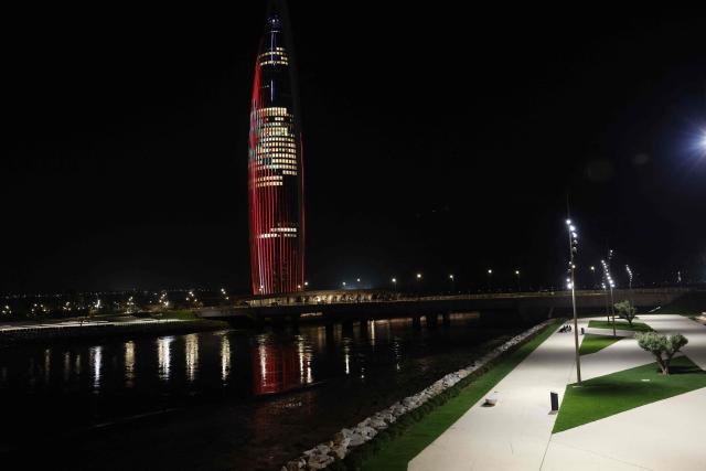 The tallest tower in Morocco, the Mohammed VI, comprising of a hotel, apartments, and restaurants, is lit up in Sale on April 20, 2026. (Photo by Abdel Majid BZIOUAT / AFP)