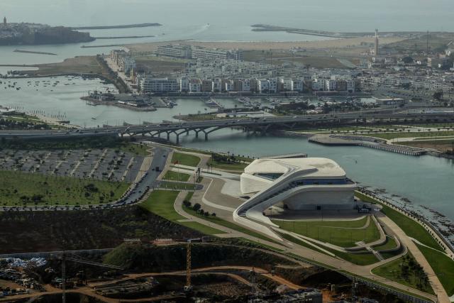 A view of the Grand Theatre of Rabat, along the Bouregreg River and the Atlantic Ocean seen from the observation deck of the Mohammed VI Tower, in Sale, bordering Rabat on April 20, 2026. (Photo by Abdel Majid BZIOUAT / AFP)