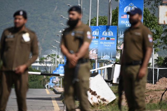 Security personnel stand guard at a checkpoint near the Serena Hotel at the Red Zone area in Islamabad on April 21, 2026, amid heightened security measures ahead of US-Iran peace talks. Pakistan's Prime Minister Shehbaz Sharif said on April 19 he had spoken by phone with Iranian President Masoud Pezeshkian ahead of anticipated US-Iran talks in Islamabad, and reaffirmed his government's readiness to mediate the conflict. US President Donald Trump is sending negotiators to Pakistan on April 20 for talks with Iran just days before a ceasefire in the Middle East expires, though Tehran has reportedly yet to decide whether it will participate. (Photo by Aamir QURESHI / AFP)