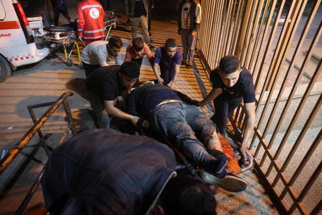 A Palestinian victim is rushed into the Nasser Hospital following an Israeli airstrike in the city of Khan Yunis, in the southern Gaza Strip on April 21, 2026. Three Palestinian residents were killed in an israeli strike that targeted the Al-Zaqzouq intersection in the Al-Amal neighborhood, west of Khan Yunis. (Photo by Bashar Taleb / AFP)