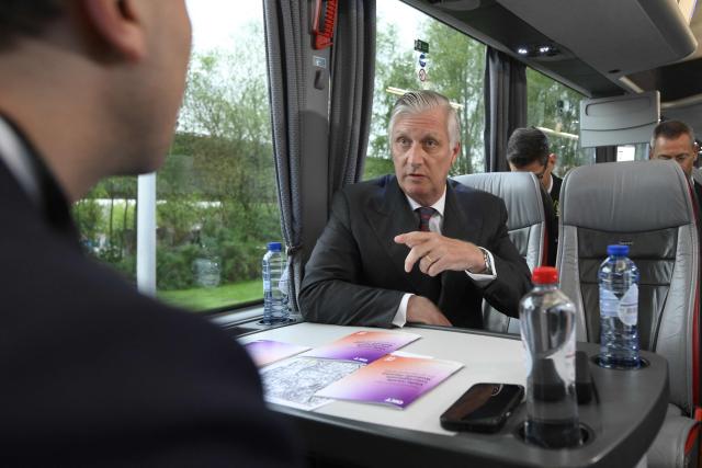 King Philippe of Belgium (C) gestures as he sits during a royal visit to the ODOO company in Louvain-la-Neuve around ICT, AI and formation on April 21, 2026. (Photo by Philip REYNAERS / Belga / AFP) / Belgium OUT