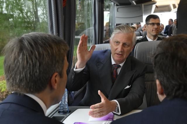 King Philippe of Belgium (C) gestures as he sits during a royal visit to the ODOO company in Louvain-la-Neuve around ICT, AI and formation on April 21, 2026. (Photo by Philip REYNAERS / Belga / AFP) / Belgium OUT