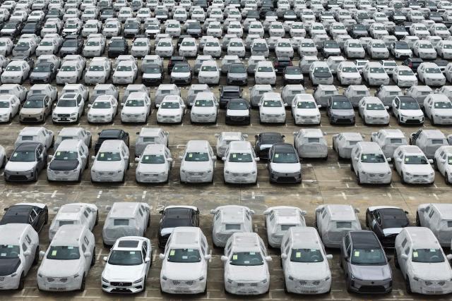 This aerial photo taken on April 20, 2026 shows Volvo cars at a port in Nanjing, in China’s eastern Jiangsu province. (Photo by CN-STR / AFP) / China OUT