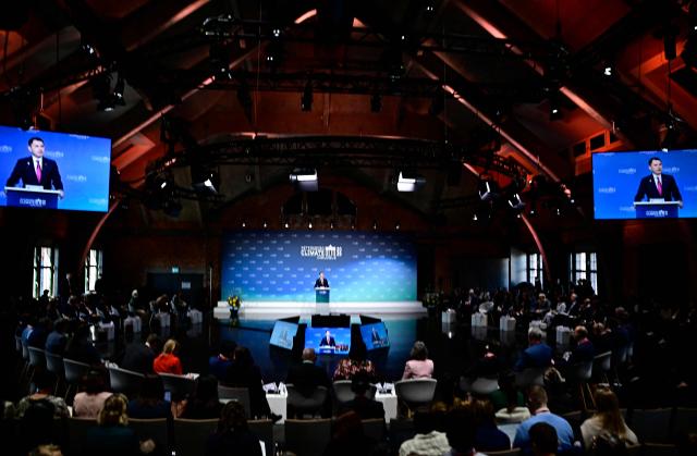 Turkey's Minister of Environment, Urbanization and Climate Change Murat Kurum addresses delegates at the start of the Petersberg Climate Dialogue (PCD) conference, on April 21, 2026 at the Westhafen Convention Center (WECC) in Berlin. The PCD is a meeting of representatives from selected countries to prepare the yearly UN Climate Change Conferences. The COP31 UN Climate Change Conference will be held in Antalya, Turkey, from November 9 to 20, 2026. (Photo by Tobias SCHWARZ / AFP)