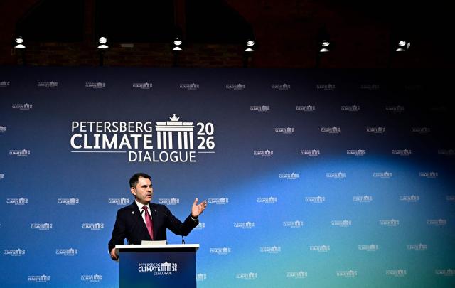 Turkey's Minister of Environment, Urbanization and Climate Change Murat Kurum addresses delegates at the start of the Petersberg Climate Dialogue (PCD) conference, on April 21, 2026 at the Westhafen Convention Center (WECC) in Berlin. The PCD is a meeting of representatives from selected countries to prepare the yearly UN Climate Change Conferences. The COP31 UN Climate Change Conference will be held in Antalya, Turkey, from November 9 to 20, 2026. (Photo by Tobias SCHWARZ / AFP)