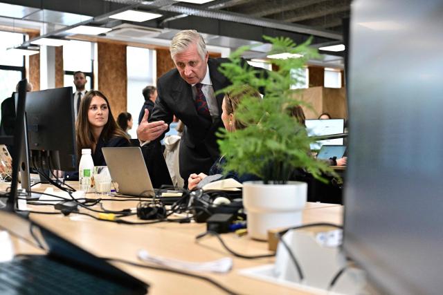 King Philippe of Belgium (C) gestures during a royal visit at the ODOO company in Louvain-la-Neuve around ICT, AI and formation on April 21, 2026. (Photo by DIRK WAEM / Belga / AFP) / Belgium OUT