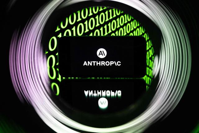 This photograph shows a smartphone displaying the logo of the US artificial intelligence safety and research company Anthropic, in Mulhouse on April 21, 2026. (Photo by SEBASTIEN BOZON / AFP)
