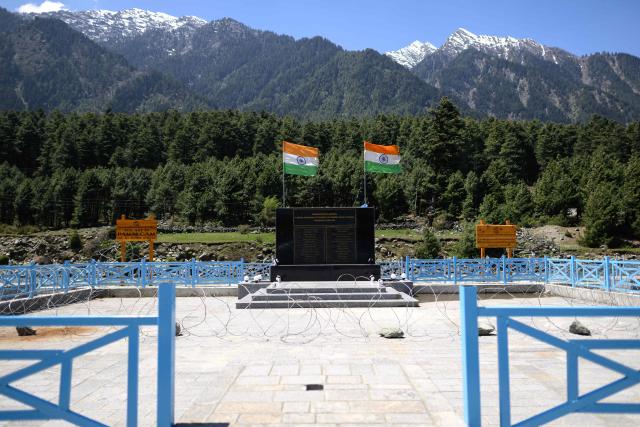 Indian national flags flutter in the wind at the memorial site for the victims of the last year’s Baisaran Valley terror attack, along the banks of Lidder river in Pahalgam in south Kashmir’s Anantnag district on April 21, 2026. Relations between nuclear-armed neighbours India and Pakistan plummeted last year after an attack in Indian-administered Kashmir killed 26 men, mostly Hindu tourists, leading to their worst conflict in decades. Gunmen burst out of forests near the resort town of Pahalgam on April 22, 2025 and raked crowds of visitors with automatic weapons. (Photo by MANAN VATSYAYANA / AFP)