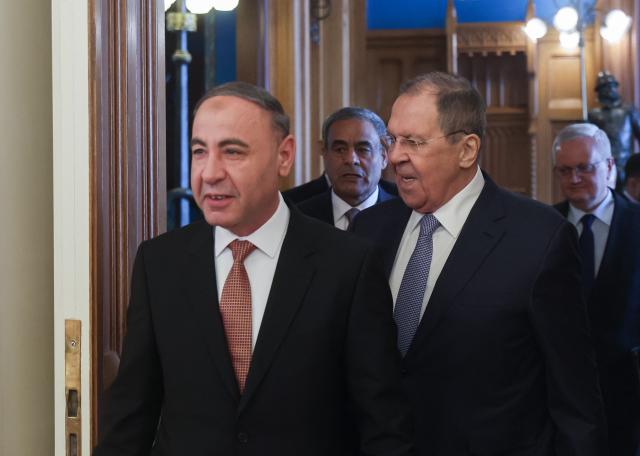 Russian Foreign Minister Sergei Lavrov and Libya's acting Foreign Minister Taher al-Baour enter a hall during their meeting at Zinaida Morozova's Mansion in Moscow on April 21, 2026. (Photo by MAXIM SHIPENKOV / POOL / AFP)