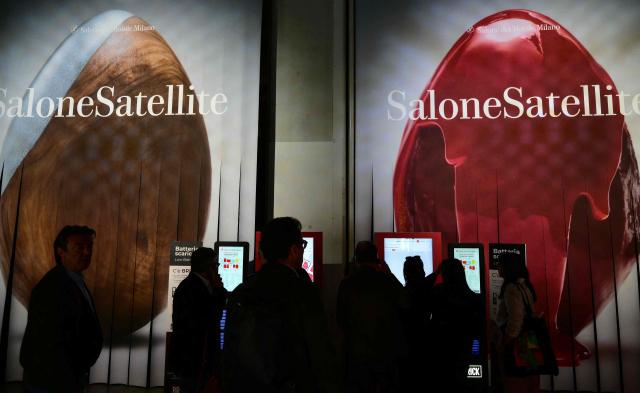 Visitors check the interactive map as they arrive at the Salone del Mobile Milano, International Furnishing and Design Fair, taking place at the Fiera Milano venue, in Rho on the outskirts of Milan, northern Italy, on April 21, 2026. (Photo by Stefano RELLANDINI / AFP)