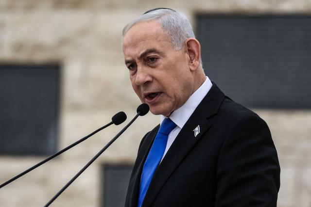 Israel’s Prime Minister Benjamin Netanyahu speaks during a ceremony commemorating Israel’s Remembrance Day for fallen soldiers, or Yom HaZikaron, at the Military Cemetery on Mount Herzl in Jerusalem on April 21, 2026. (Photo by Ilia YEFIMOVICH / POOL / AFP)