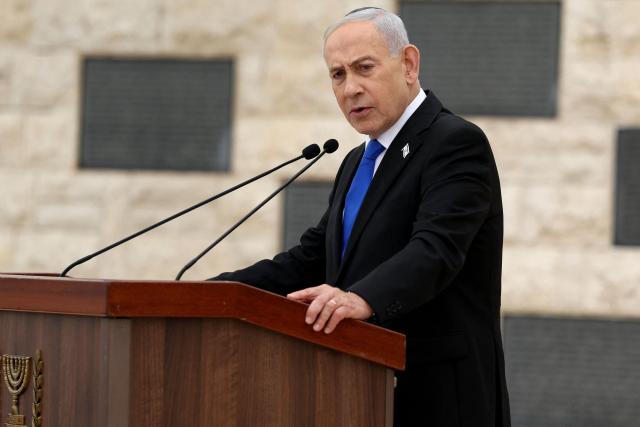 Israel’s Prime Minister Benjamin Netanyahu speaks during a ceremony commemorating Israel’s Remembrance Day for fallen soldiers, or Yom HaZikaron, at the Military Cemetery on Mount Herzl in Jerusalem on April 21, 2026. (Photo by Ilia YEFIMOVICH / POOL / AFP)
