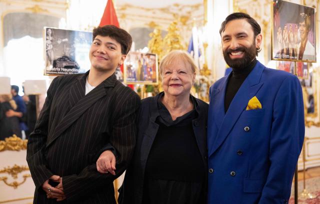 Austrian singer Johannes Pietsch aka JJ (L), winner of the 2025 Eurovision Song Contest, and Austrian singer and actor Conchita Wurst (R), winner of the 2014 Eurovision Song Contest, and Austrian singer Marianne Mendt, participant of the ESC 1971, give an interview following a reception held by the Austrian President for Austrian ESC participants at Hofburg Palace in Vienna, Austria on April 21, 2026, ahead of the 70th edition of the Eurovision Song Contest (ESC). The two semi-finals of the ESC will take place on May 12 and May 14 and the final on May 16, 2026. (Photo by Joe Klamar / AFP)