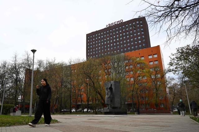 The logo of Eksmo, Russia's largest publisher, sits on top of the publishing house's central office building in Moscow on April 21, 2026. Russian police on April 21, 2026 raided the country's top publishing house in a case over the publication of "LGBT literature". (Photo by Igor IVANKO / AFP)