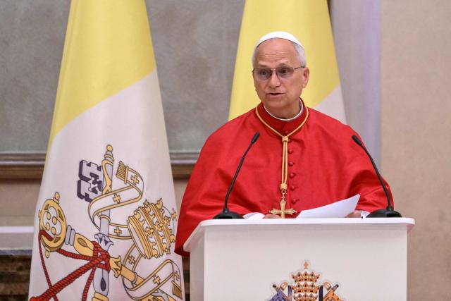 Pope Leo XIV speaks as he meets with authorities, civil society and the diplomatic corps at the Presidential Palace in Malabo on the ninth day of an 11-day apostolic journey to Africa, on April 21, 2026. (Photo by Alberto PIZZOLI / AFP)